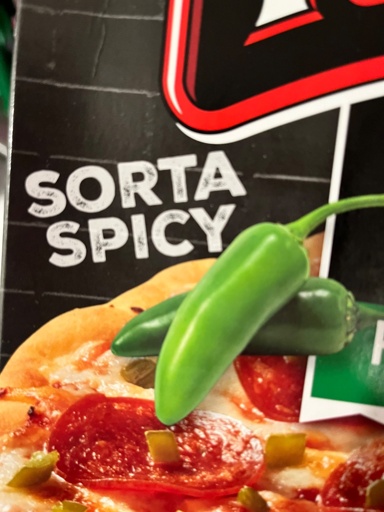 Jalapeños over a pizza with caption "SORTA SPICY". Seen on a frozen pizza box. 
